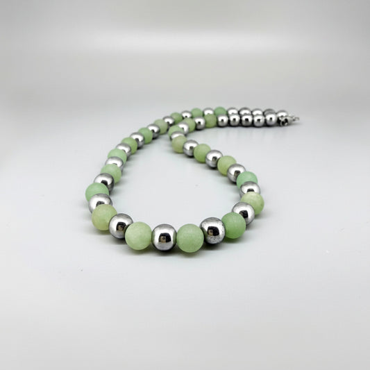 Handcrafted aventurine and hematite necklace in light green with metallic accents, 42 cm.