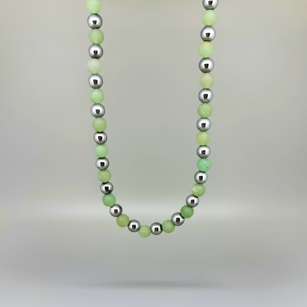 Handcrafted aventurine and hematite necklace in light green with metallic accents, 42 cm.