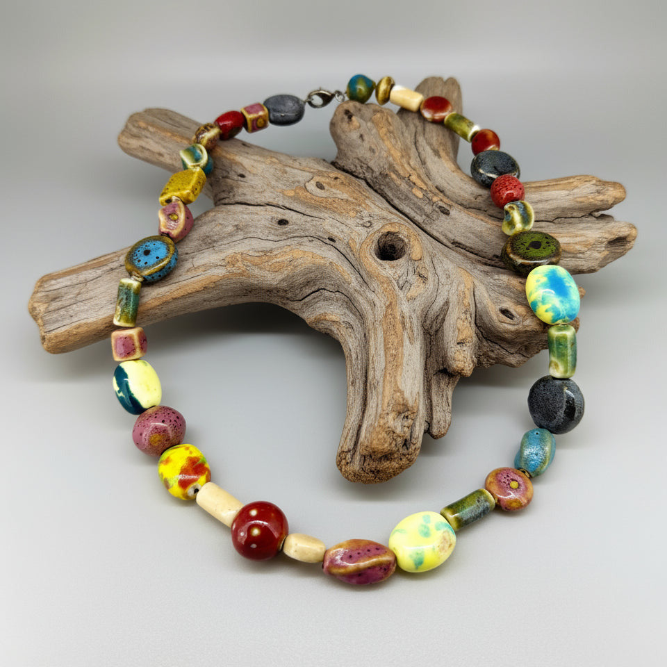 Multicolored ceramic beaded necklace, 50 cm / 19.7 in long, featuring handmade glazed beads in bright and earthy tones.