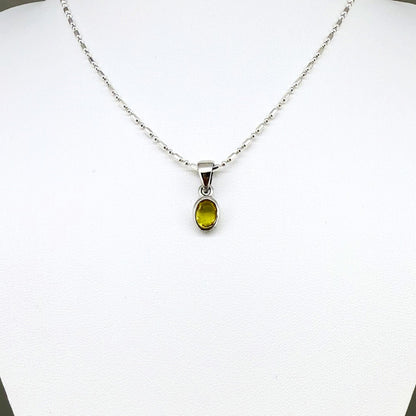 Handcrafted three-pendant gemstone necklace with sapphires, ruby, spinel, and tsavorite (5.81 ct total) on a black leather cord — modular design in white-gold-plated silver.