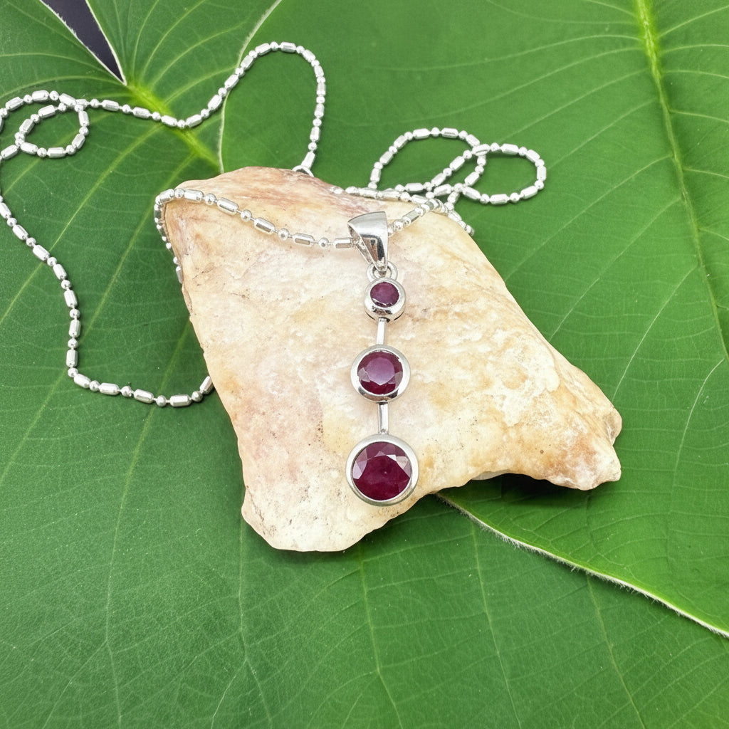Handcrafted pendant with three natural rubies (2.92 ct total) set vertically in white-gold-plated sterling silver.