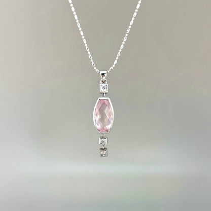 Handmade white gold plated silver pendant with 14.76 ct rose quartz and cubic zirconia accents, elegant and refined design.