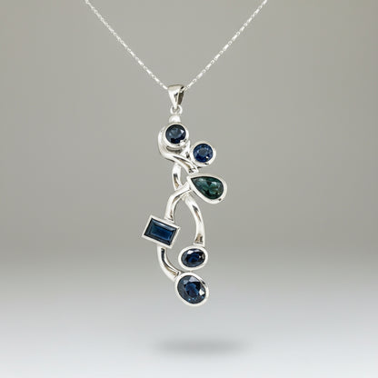 Handmade pendant with 14.68 ct natural blue sapphires set in white-gold-plated sterling silver.