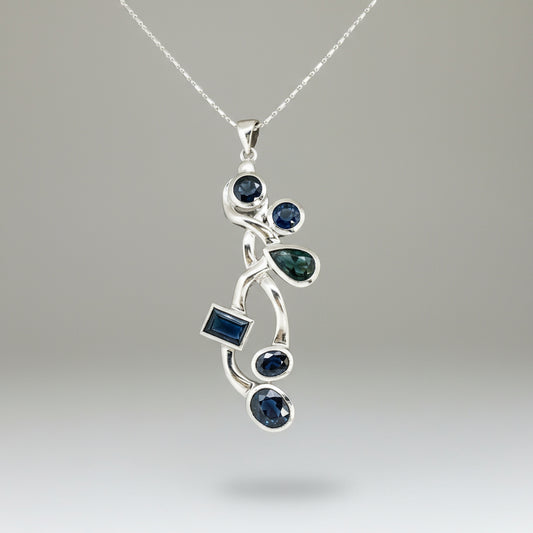 Handmade pendant with 14.68 ct natural blue sapphires set in white-gold-plated sterling silver.