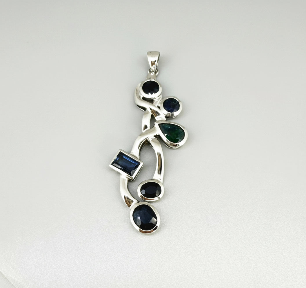 Handmade pendant with 14.68 ct natural blue sapphires set in white-gold-plated sterling silver.