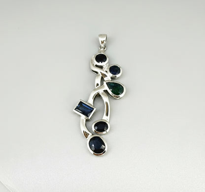 Handmade pendant with 14.68 ct natural blue sapphires set in white-gold-plated sterling silver.
