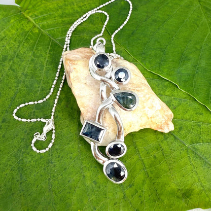 Handmade pendant with 14.68 ct natural blue sapphires set in white-gold-plated sterling silver.