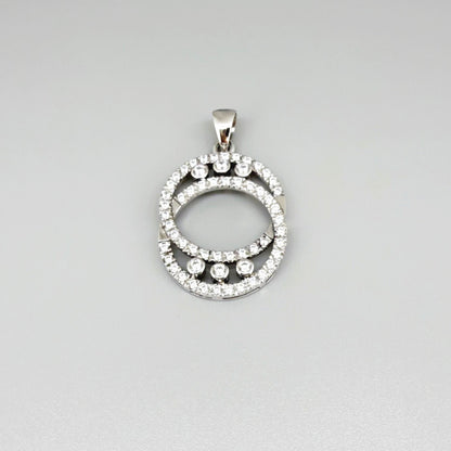 Handcrafted round pendant with cubic zirconia set in white-gold-plated sterling silver.