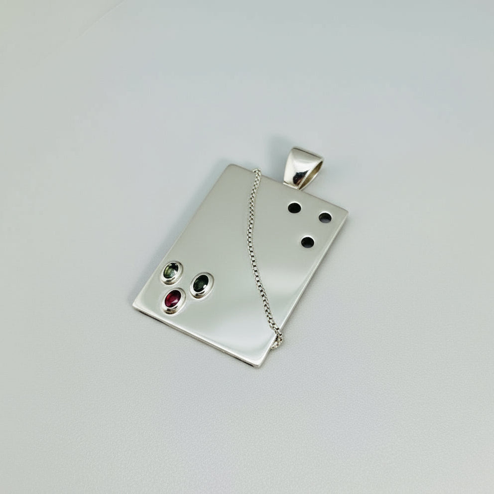 Handcrafted rectangular silver pendant with three natural tourmalines in green, pink, and yellow (2.16 ct total).