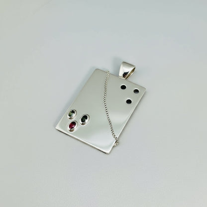 Handcrafted rectangular silver pendant with three natural tourmalines in green, pink, and yellow (2.16 ct total).