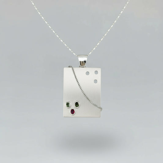 Handcrafted rectangular silver pendant with three natural tourmalines in green, pink, and yellow (2.16 ct total).