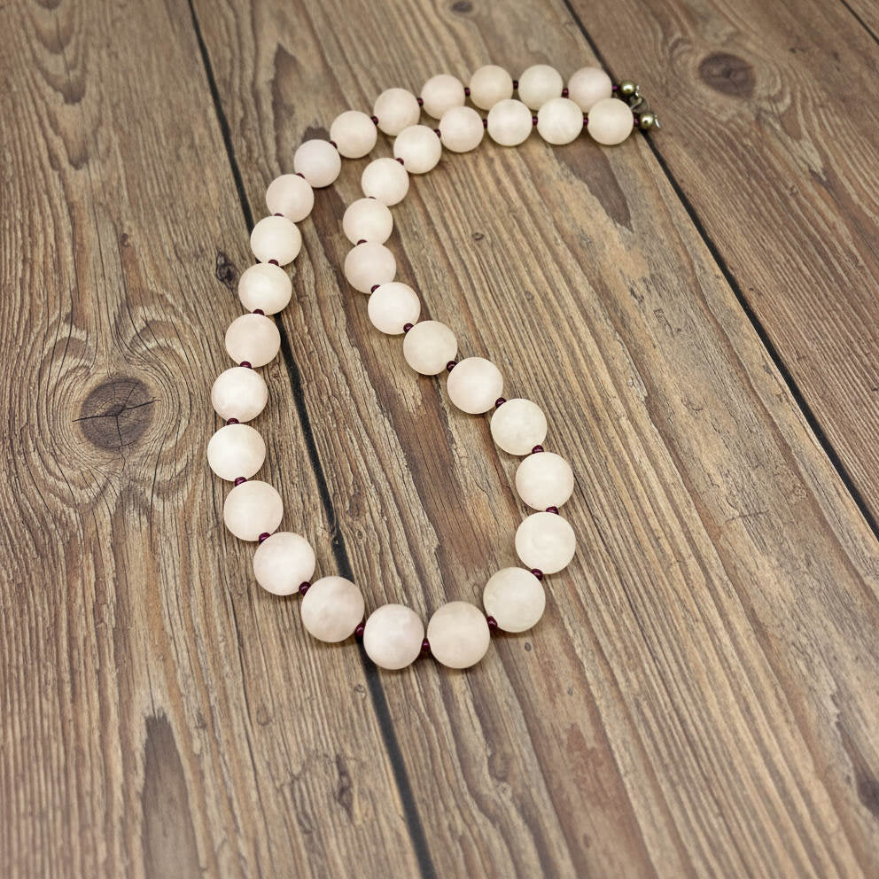 Matte rose quartz beaded necklace, 44 cm long, featuring softly polished natural rose quartz spheres in pale pink tones.
