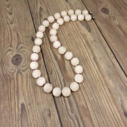 Matte rose quartz beaded necklace, 44 cm long, featuring softly polished natural rose quartz spheres in pale pink tones.
