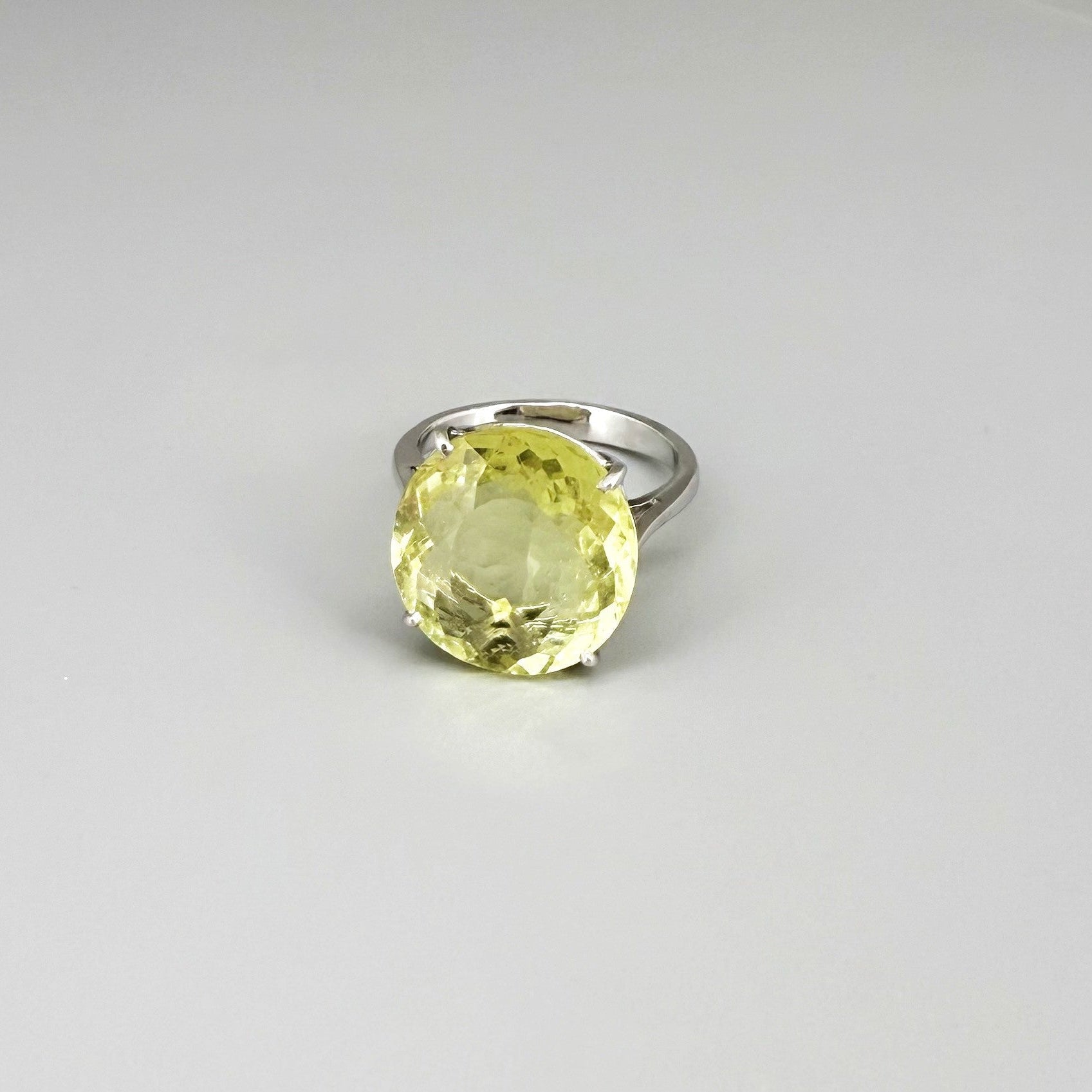 Lemon quartz ring in white gold plated sterling silver, featuring a faceted soft yellow gemstone with brilliant clarity, elegant and timeless design.