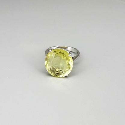 Lemon quartz ring in white gold plated sterling silver, featuring a faceted soft yellow gemstone with brilliant clarity, elegant and timeless design.