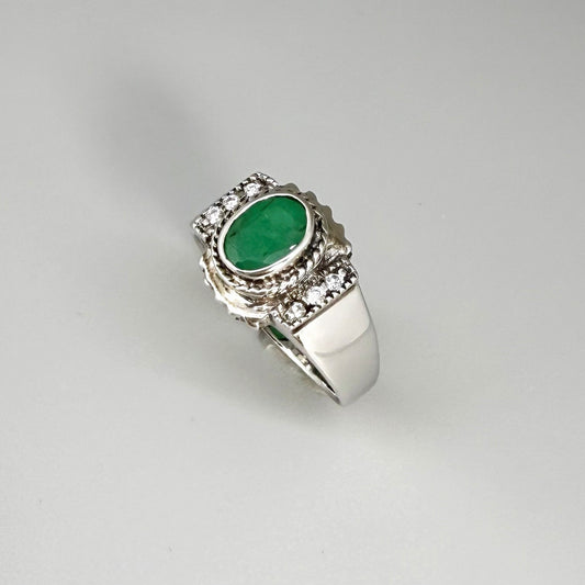 Green quartz cabochon ring in white gold plated sterling silver, featuring an oval vivid green gemstone with soft translucent glow and refined silver design.