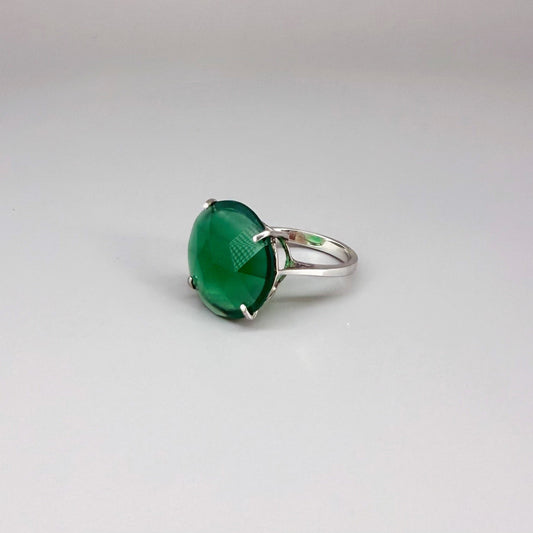 White gold plated sterling silver ring with large faceted green chalcedony gemstone, elegant solitaire design with rich natural color.