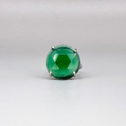 White gold plated sterling silver ring with large faceted green chalcedony gemstone, elegant solitaire design with rich natural color.