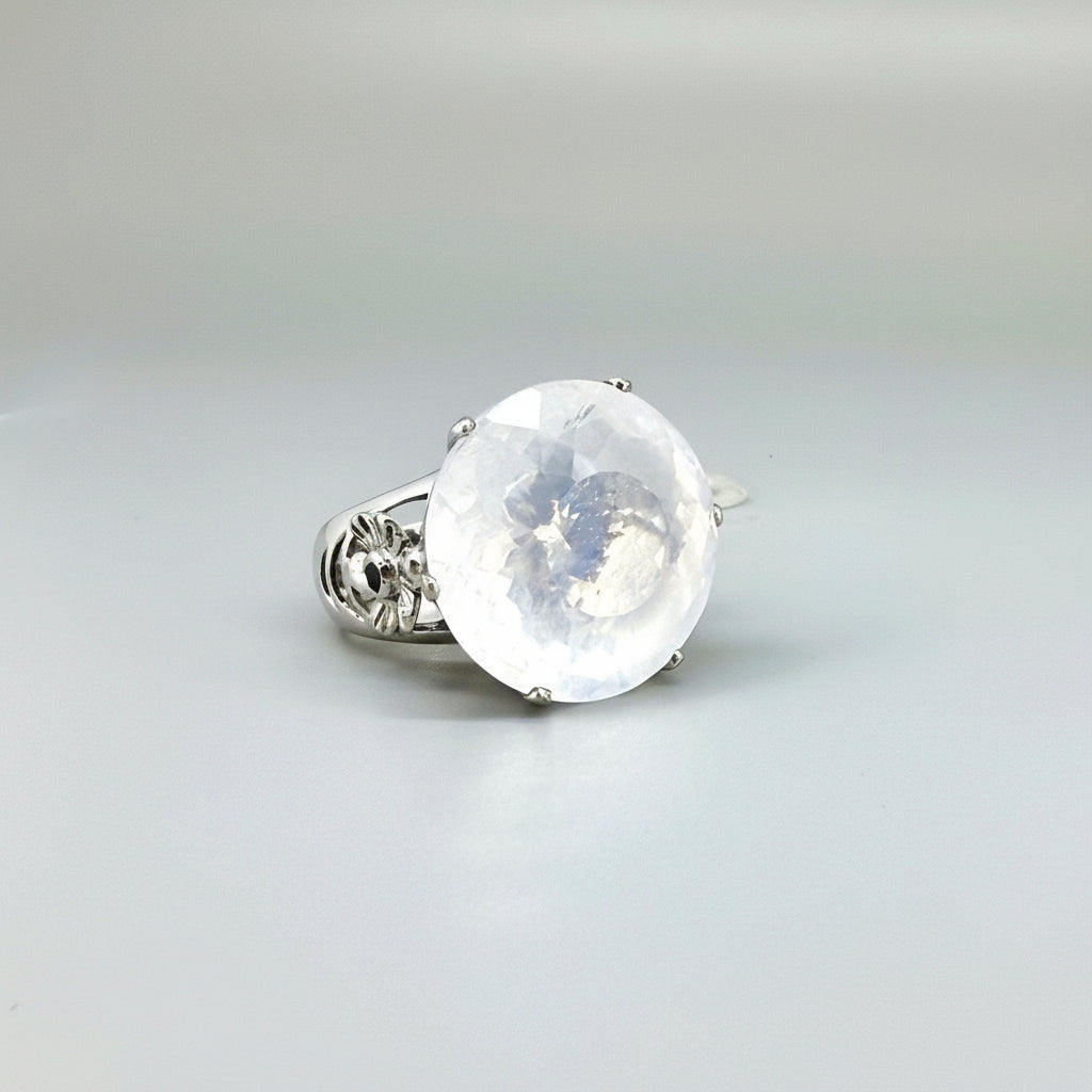 Handcrafted white gold-plated silver ring featuring a large 26.47 ct faceted white quartz gemstone.