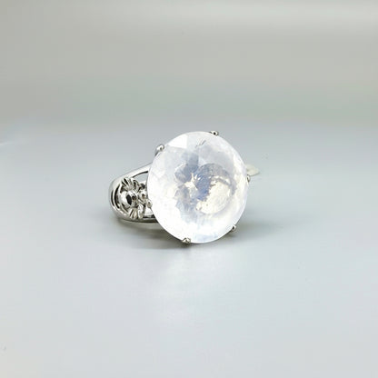 Handcrafted white gold-plated silver ring featuring a large 26.47 ct faceted white quartz gemstone.