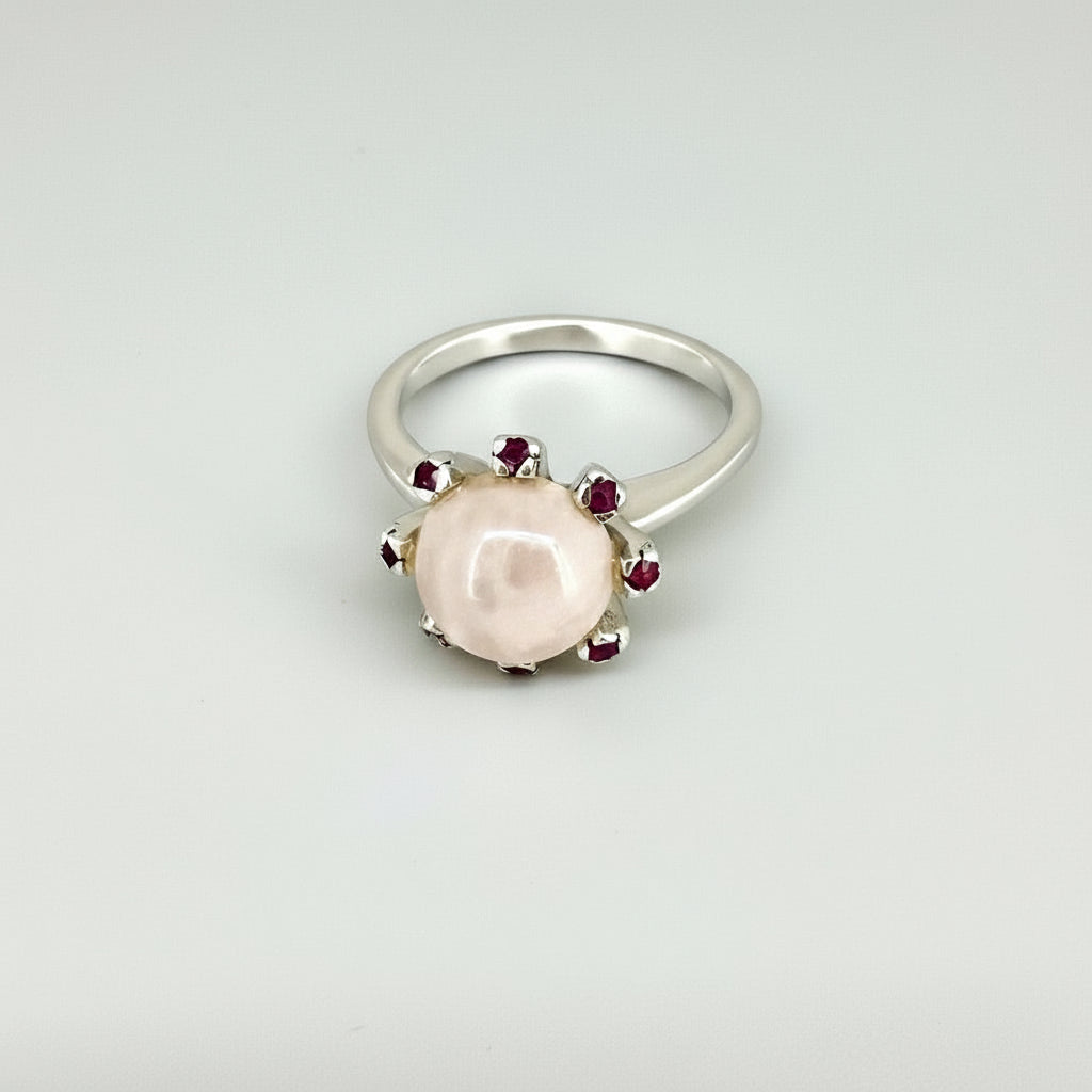 Handcrafted ring with 4.02 ct rose quartz and 0.23 ct rubies set in white-gold-plated sterling silver.