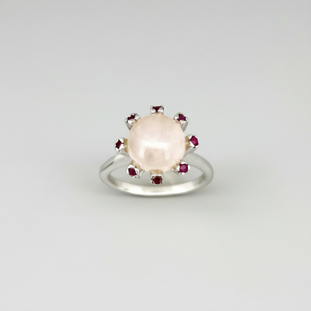Handcrafted ring with 4.02 ct rose quartz and 0.23 ct rubies set in white-gold-plated sterling silver.