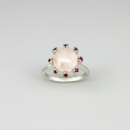 Handcrafted ring with 4.02 ct rose quartz and 0.23 ct rubies set in white-gold-plated sterling silver.