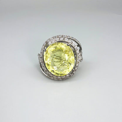 Lemon quartz and CZ ring in white gold plated sterling silver, featuring a faceted yellow gemstone framed by clear cubic zirconia, elegant and radiant design.