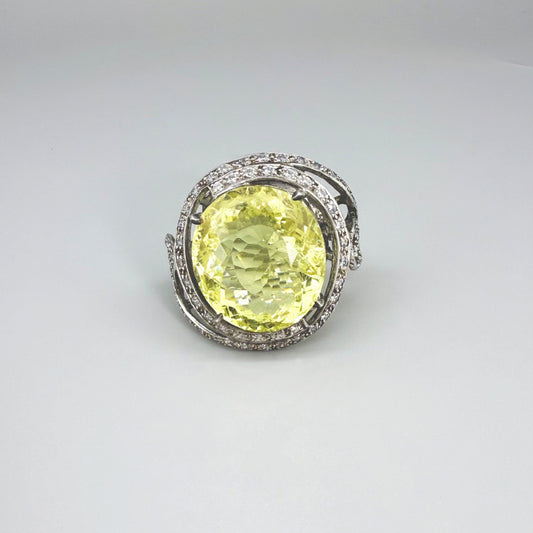 Lemon quartz and CZ ring in white gold plated sterling silver, featuring a faceted yellow gemstone framed by clear cubic zirconia, elegant and radiant design.