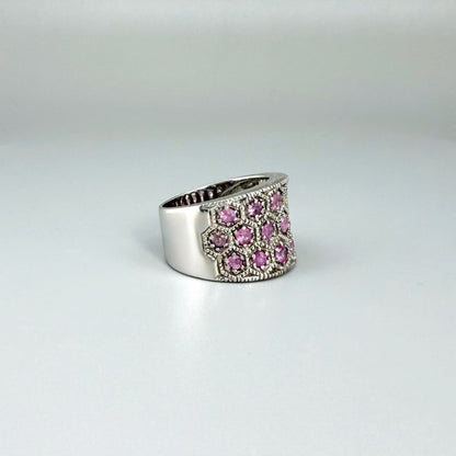 Ruby band ring in white gold plated sterling silver, featuring faceted natural red gemstones in a wide band design, elegant and luxurious style.