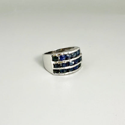 Sapphire band ring in white gold plated sterling silver, featuring three rows of natural deep blue gemstones, elegant and timeless design.