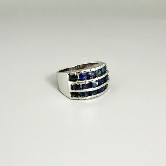 Sapphire band ring in white gold plated sterling silver, featuring three rows of natural deep blue gemstones, elegant and timeless design.