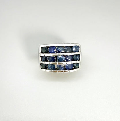 Sapphire band ring in white gold plated sterling silver, featuring three rows of natural deep blue gemstones, elegant and timeless design.