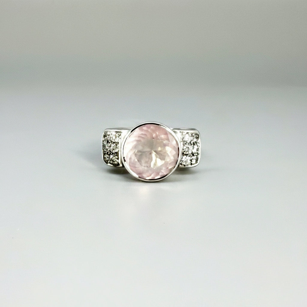 Rose quartz and CZ ring in white gold plated sterling silver, featuring a natural pink gemstone with clear sparkling accents, elegant and feminine design.