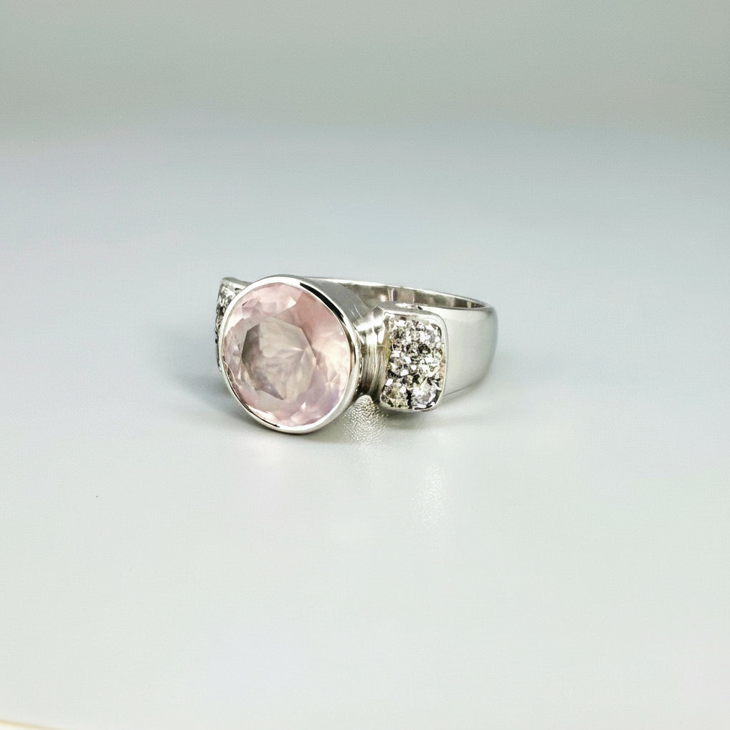 Rose quartz and CZ ring in white gold plated sterling silver, featuring a natural pink gemstone with clear sparkling accents, elegant and feminine design.