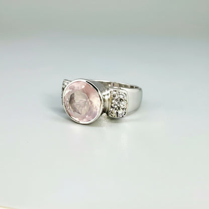 Rose quartz and CZ ring in white gold plated sterling silver, featuring a natural pink gemstone with clear sparkling accents, elegant and feminine design.