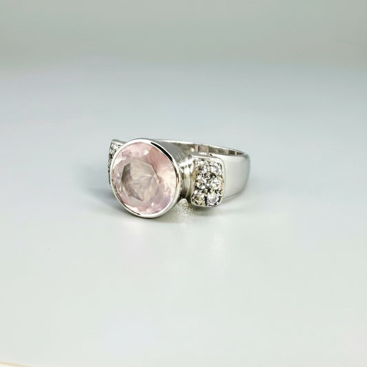 Rose quartz and CZ ring in white gold plated sterling silver, featuring a natural pink gemstone with clear sparkling accents, elegant and feminine design.