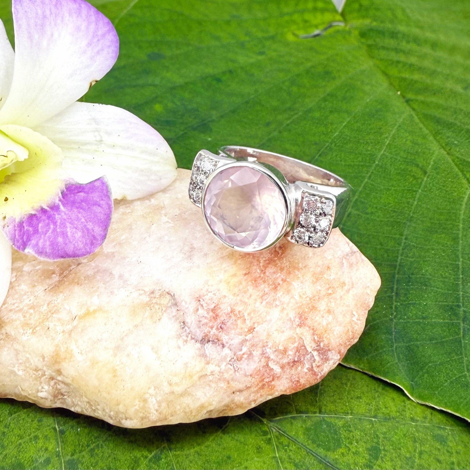 Rose quartz and CZ ring in white gold plated sterling silver, featuring a natural pink gemstone with clear sparkling accents, elegant and feminine design.