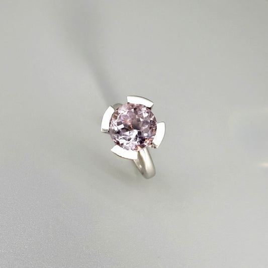 Handmade amethyst and CZ ring in white gold plated sterling silver on neutral background