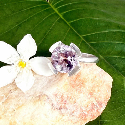 Handmade amethyst and CZ ring in white gold plated sterling silver on neutral background