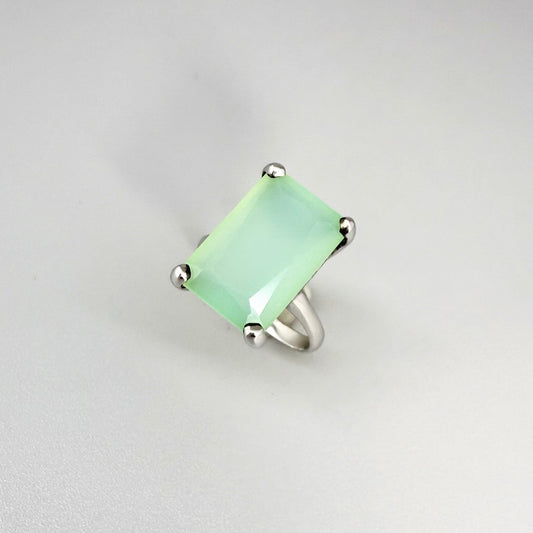 Green chalcedony ring in white gold plated sterling silver, featuring a rectangular-cut soft mint green gemstone with gentle translucence, elegant design.