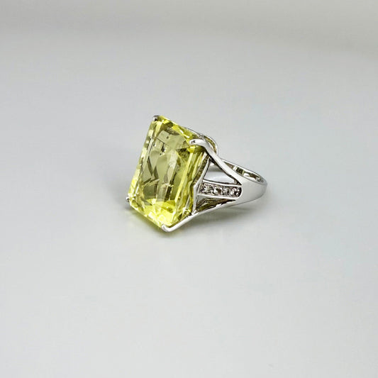 Chrysoprase and CZ ring in white gold plated sterling silver, featuring a rectangular bright green gemstone with clear cubic zirconia side accents, elegant and modern design.