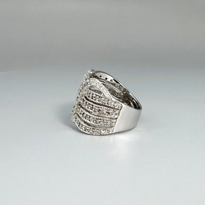 Wide band cubic zirconia ring in white gold plated sterling silver, featuring clear brilliant stones for a radiant, timeless sparkle.