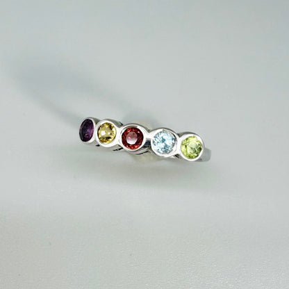 Multicolor gemstone ring in white gold plated sterling silver featuring citrine, tourmaline, rhodolite, and topaz, elegant band design with warm and cool tones.