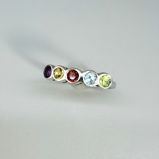 Multicolor gemstone ring in white gold plated sterling silver featuring citrine, tourmaline, rhodolite, and topaz, elegant band design with warm and cool tones.