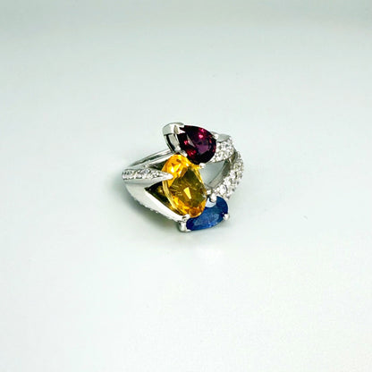Sapphire, citrine, and rhodolite ring in white gold plated sterling silver, framed with sparkling cubic zirconia, featuring vivid natural gemstones in elegant design.