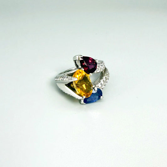 Sapphire, citrine, and rhodolite ring in white gold plated sterling silver, framed with sparkling cubic zirconia, featuring vivid natural gemstones in elegant design.