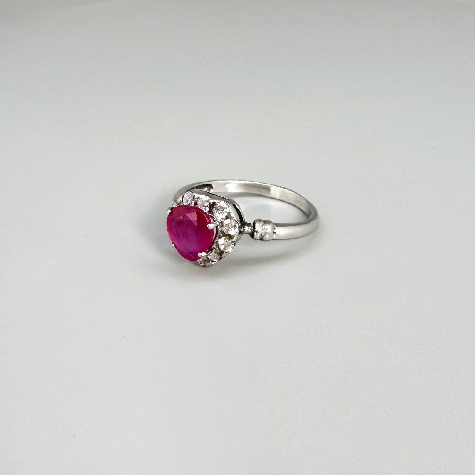 Ruby and CZ ring in white gold plated sterling silver, featuring a vivid red natural ruby with sparkling cubic zirconia accents, elegant and timeless design.