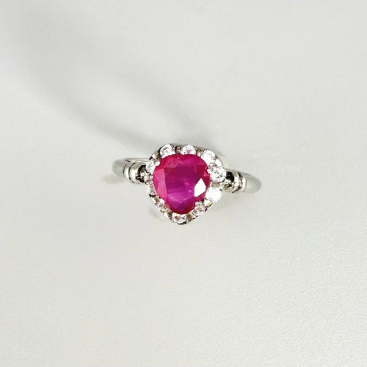 Ruby and CZ ring in white gold plated sterling silver, featuring a vivid red natural ruby with sparkling cubic zirconia accents, elegant and timeless design.