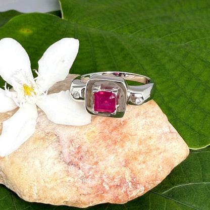 Ruby and CZ ring in white gold plated sterling silver, featuring a vivid red natural ruby framed by clear cubic zirconia, elegant and classic design.